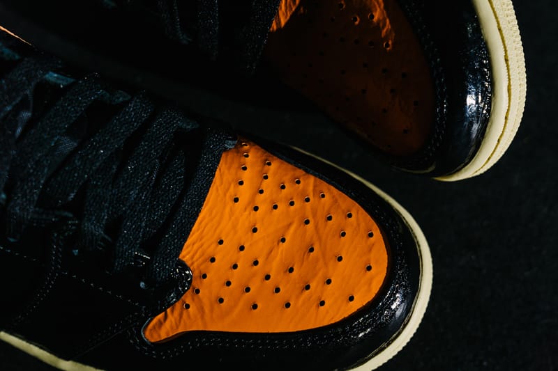 Black and hotsell orange jordan 1s