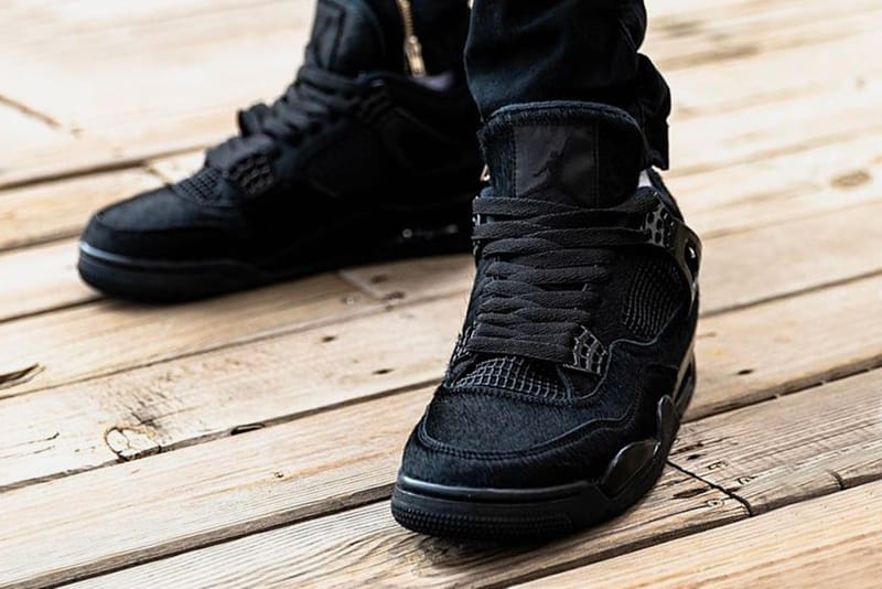 Jordan black store cat on feet