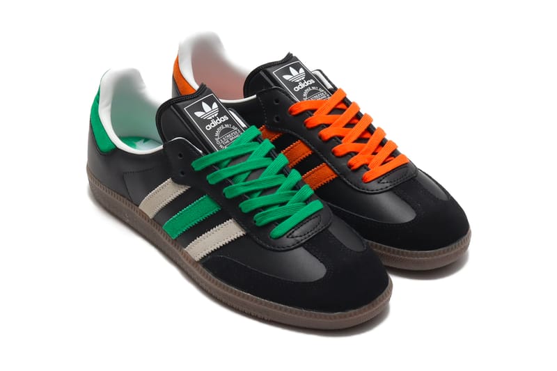 Black adidas cheap with green stripes