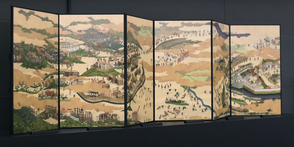Художник анимирует традиционную японскую ширму с воинами-самураями