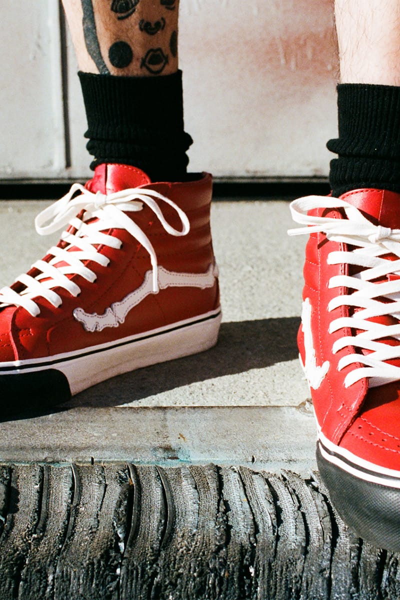 All red high outlet top vans on feet