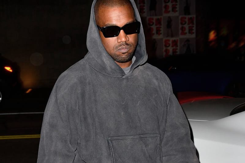 Kanye west shop wearing hoodie