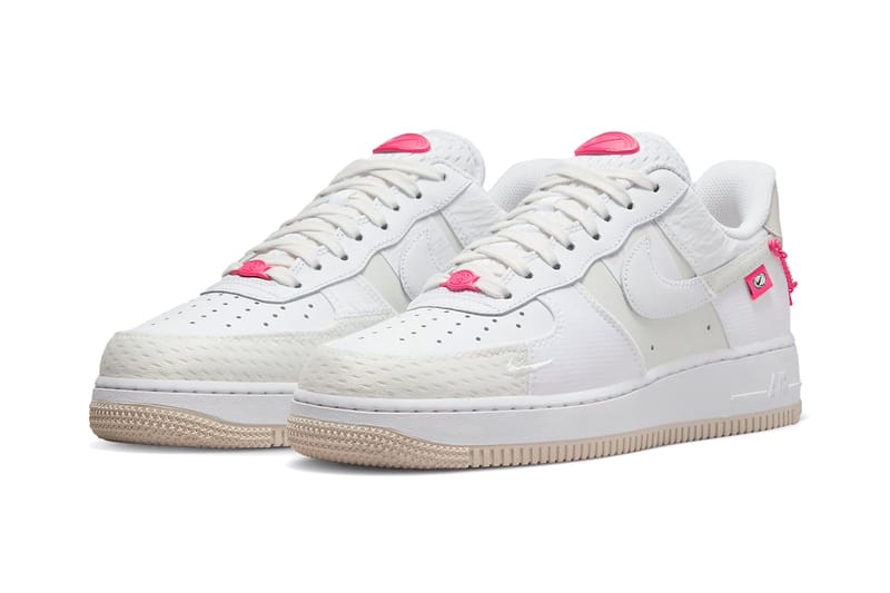 white nike sneakers with pink swoosh