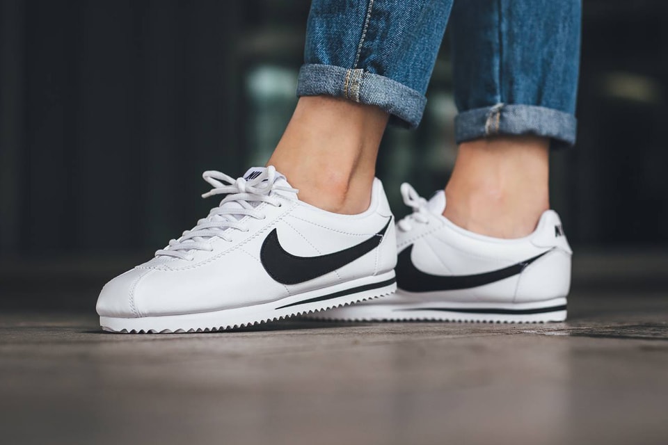 nike cortez leather trainers in white with black swoosh