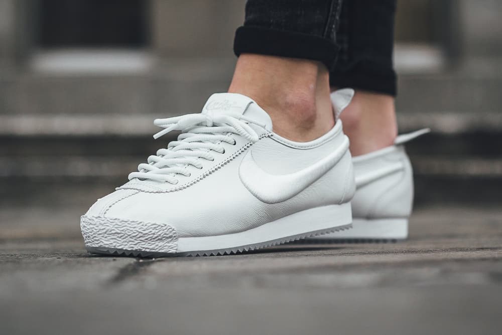 white and blue nike cortez