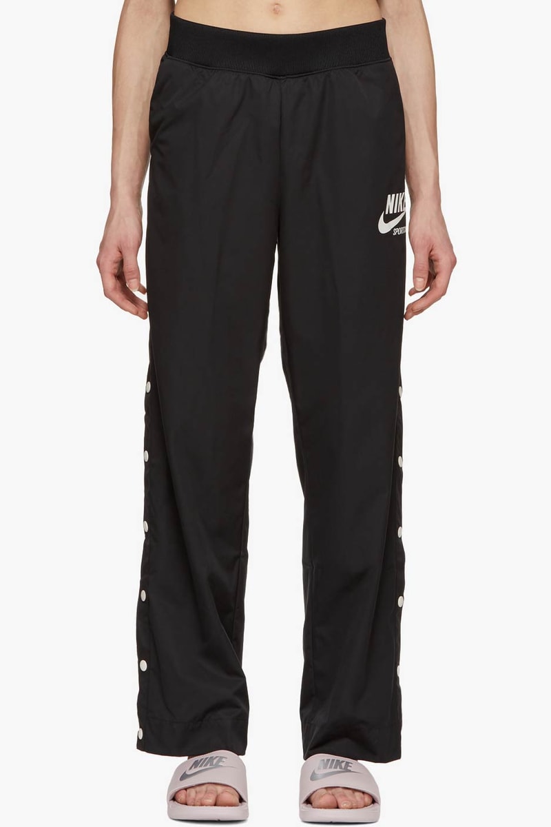 Buy Nike's Snap Button Track Pants in Black Hypebae