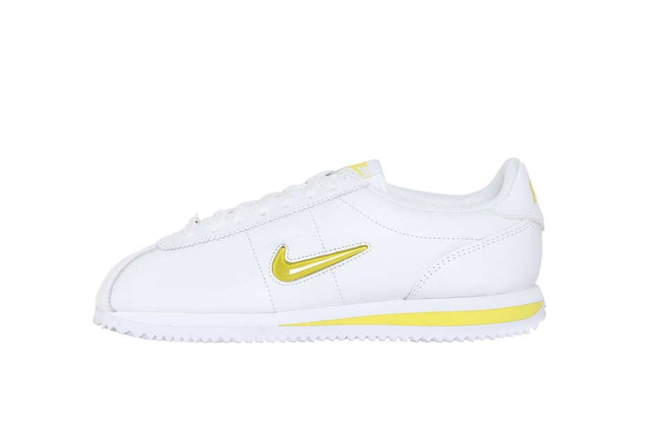 white and yellow nike cortez