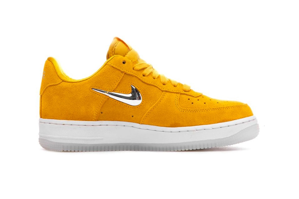 nike yellow air forces with charms