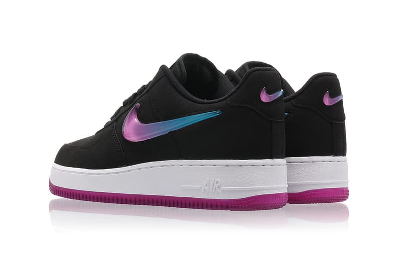 pink nikes with blue swoosh