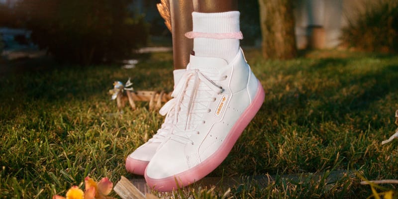 Adidas originals sleek mid top sneaker in white store and pink