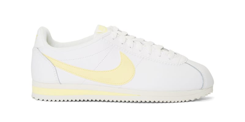 white and yellow nike cortez