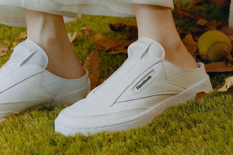 White store sneaker mules