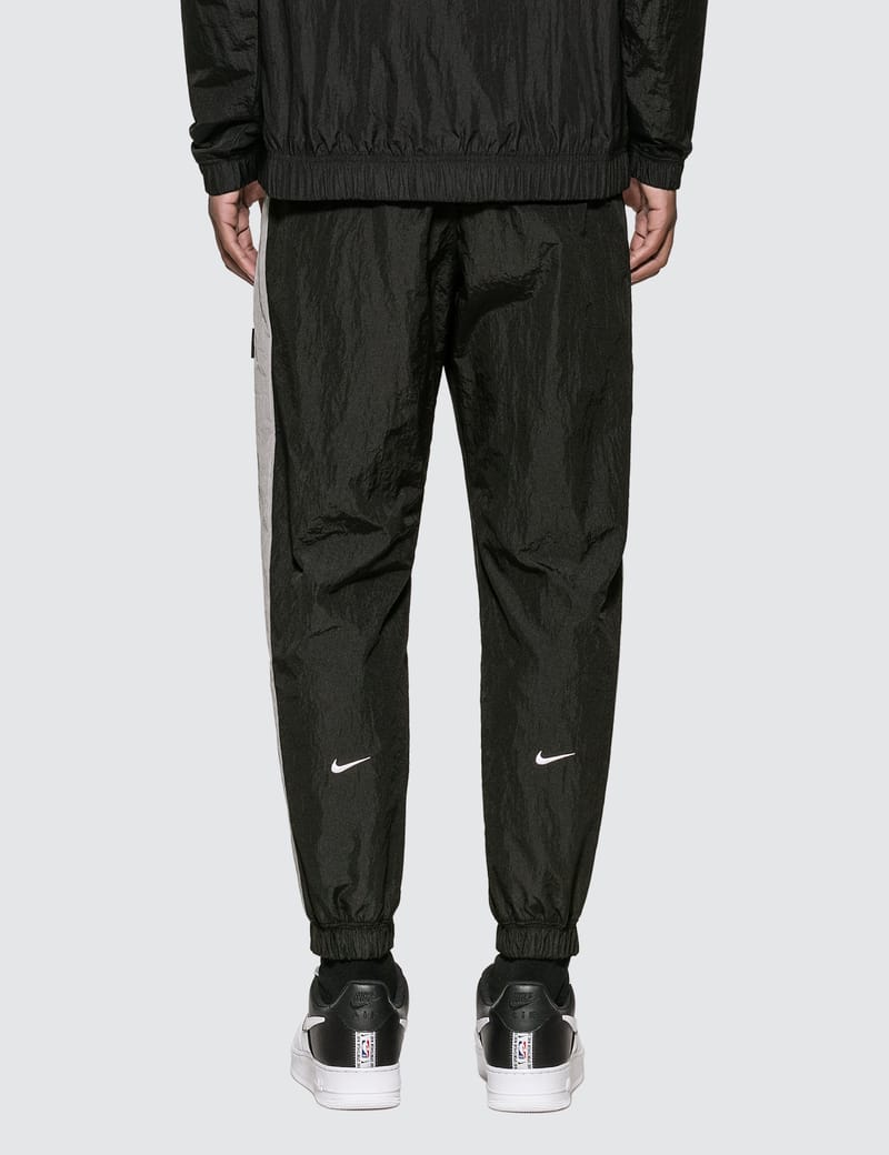 Nike - Nike Sportswear Swoosh Woven Trousers | HBX - Globally