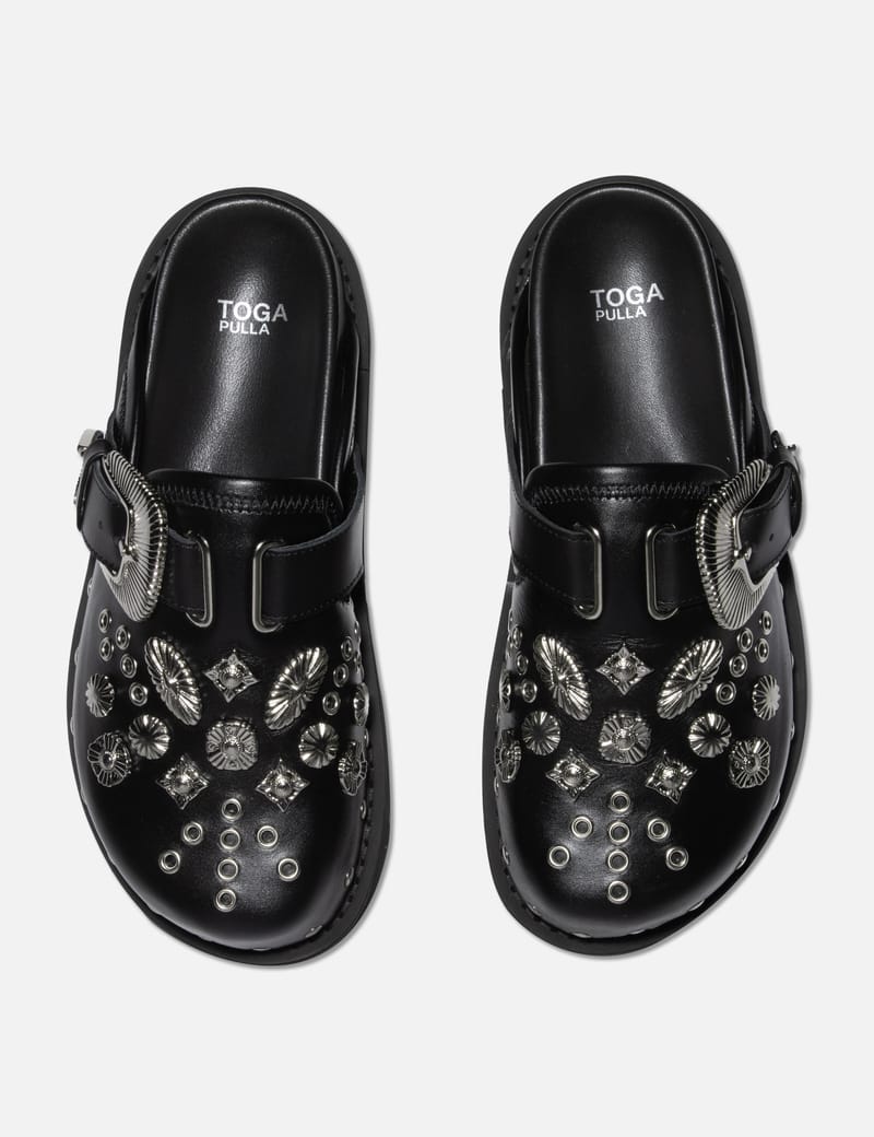 Toga Pulla - BUCKLED CLOGS | HBX - Globally Curated Fashion and