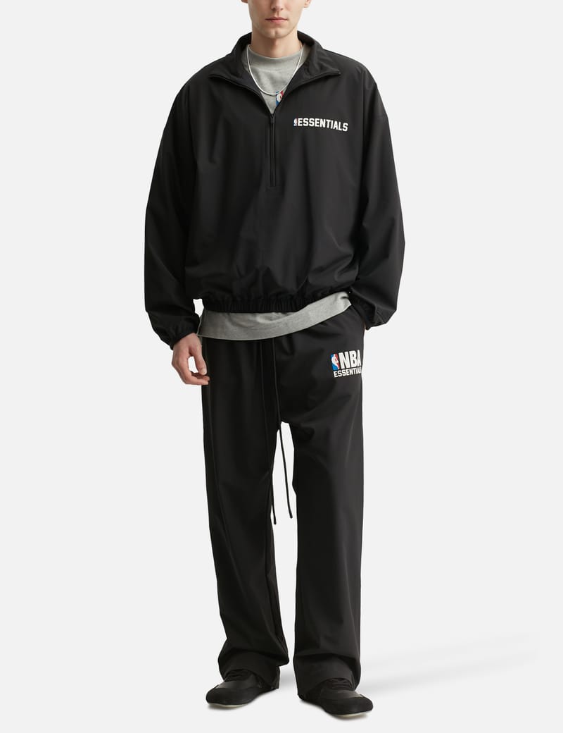 Fear of God Essentials NBA Nylon Tearaway Pant - Black wide-leg Fear of God Essentials NBA Nylon Tearaway Pant - Black wide-leg