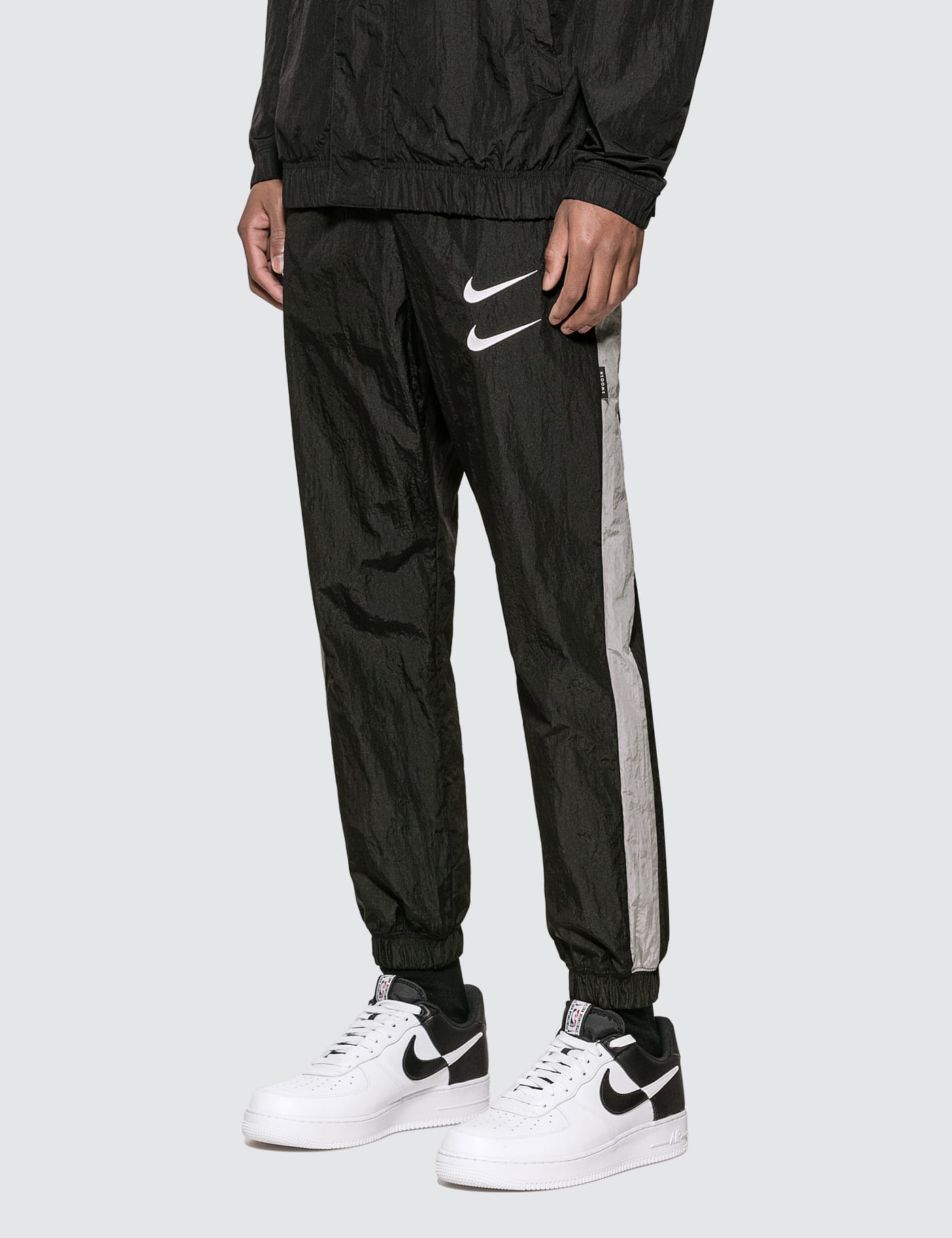 Nike - Nike Sportswear Swoosh Woven Trousers | HBX - Globally 