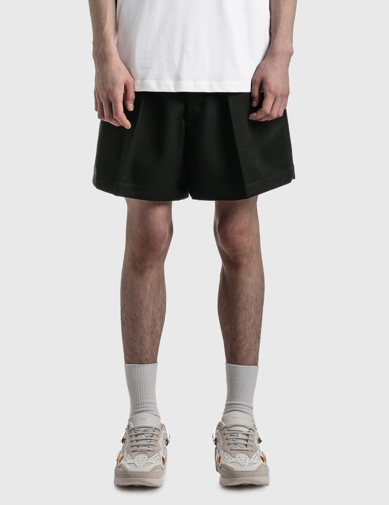 Raf Simons - WIDE FIT PLEATED SHORTS | HBX - Globally Curated