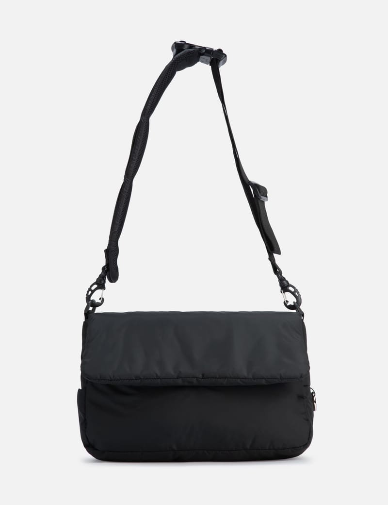 CLESSTE PADDED FLAP HOLIDAY BAG - Padded nylon bag with magnetic