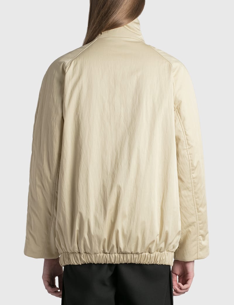 ジャケット・アウター LEMAIRE WADDED ASYMETRICAL BLOUSON Wadded Asymmetrical Jacket — Mist – La Garçonne