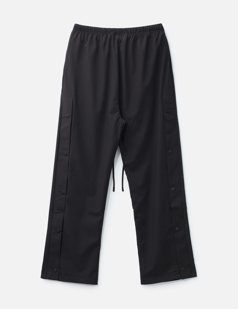 Fear of God Essentials NBA Nylon Tearaway Pant - Black wide-leg