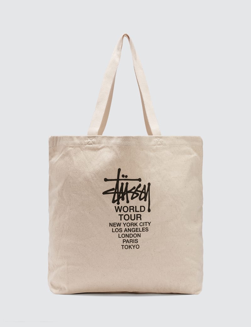 Stüssy - Canvas Tour Tote Bag | HBX - Globally Curated Fashion and