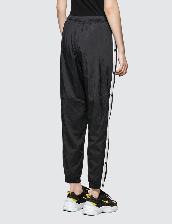 Nike - As W Nsw Wr Pant Popper | HBX - Globally Curated Fashion and Lifestyle by Hypebeast