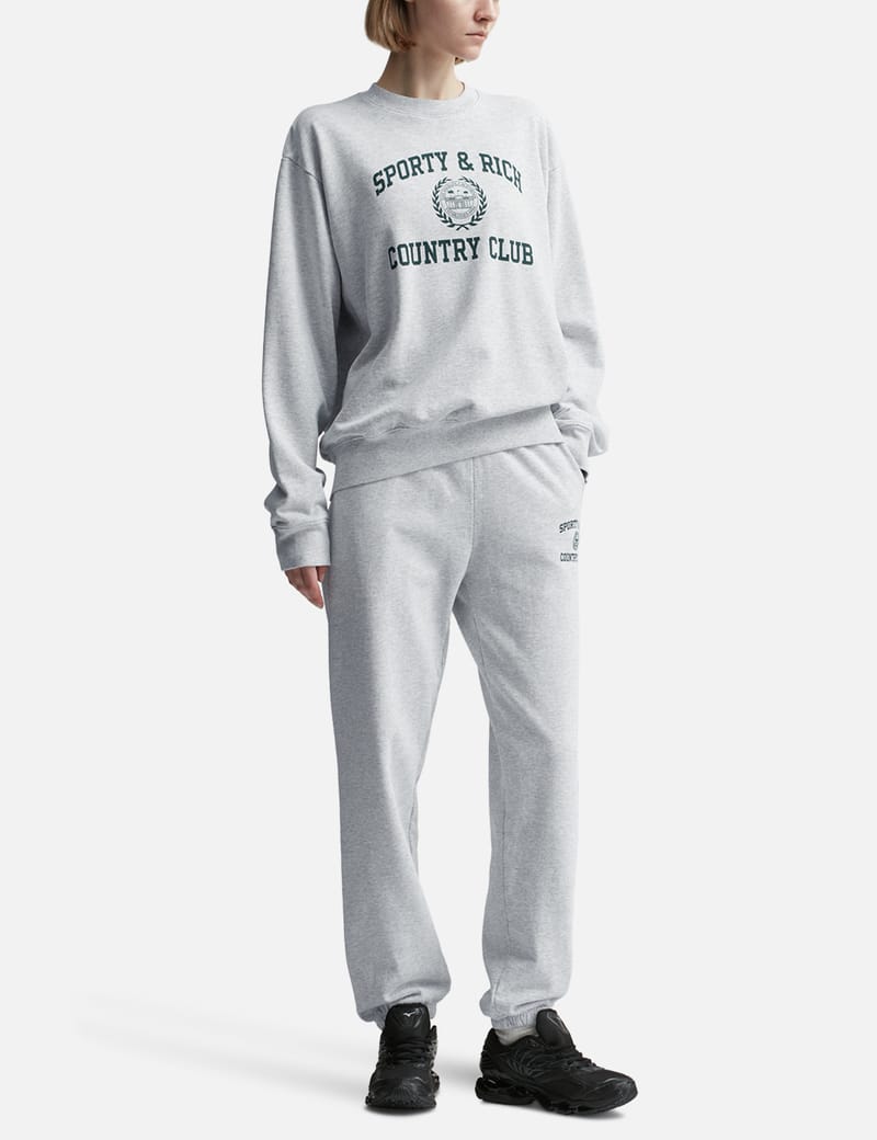【Sporty & Rich】バーシティ クレスト クルーネックスウェット Sporty & Rich - バーシティ クレスト クルーネック | HBX