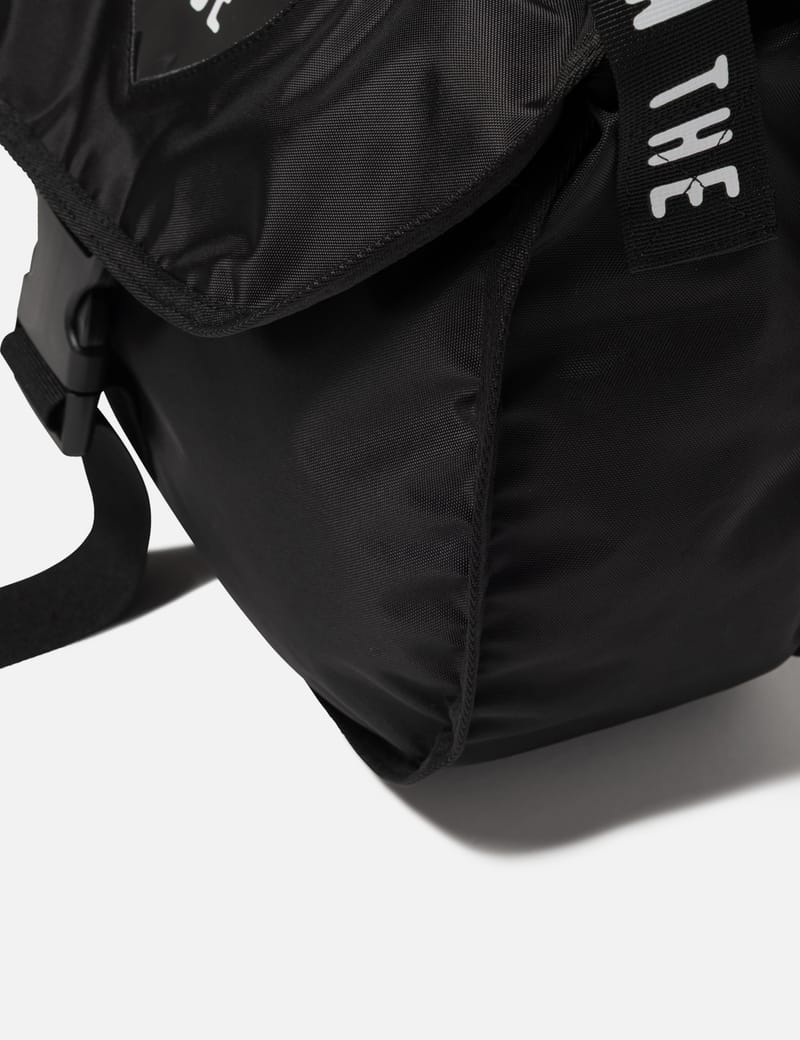 Human Made Shoulder Bag - Black nylon bag with logo strap and A4
