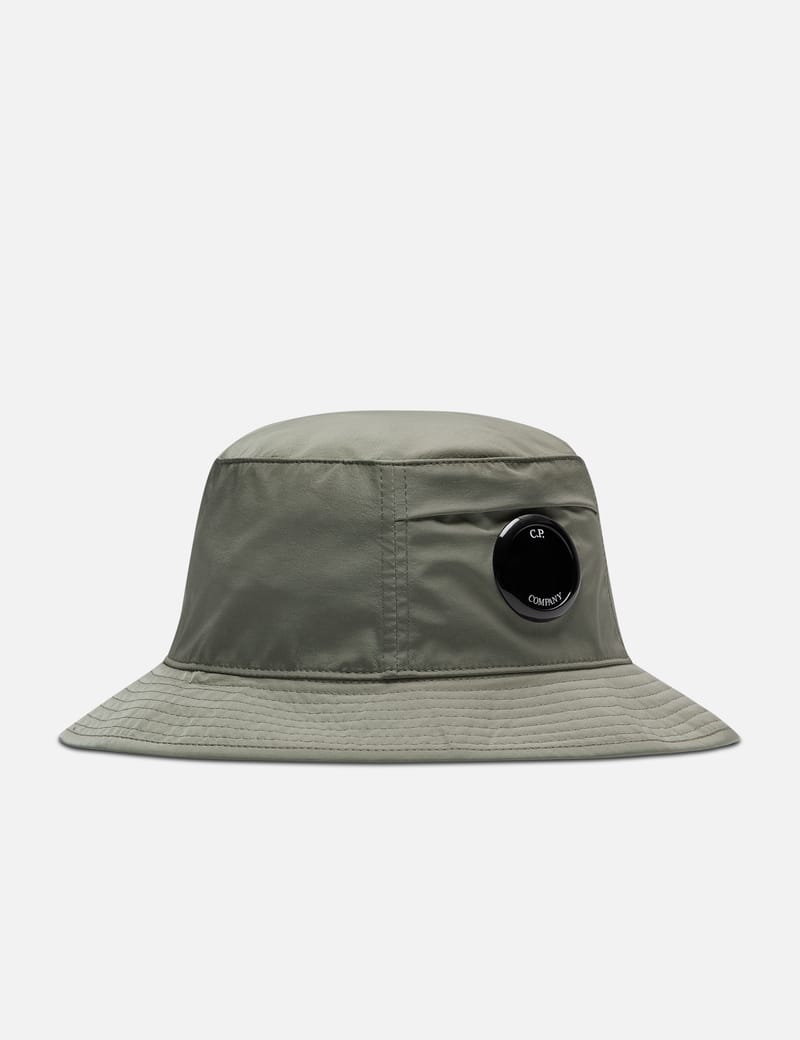 C.P. Company - CHROME-R LENS BUCKET HAT | HBX - Globally Curated