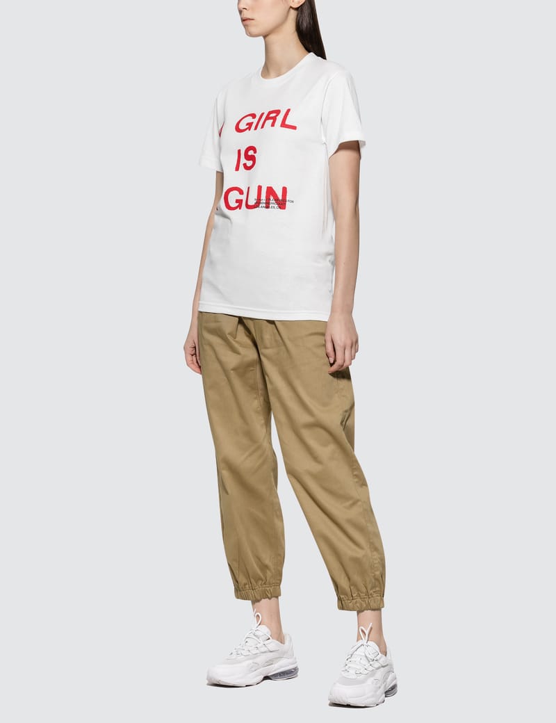 PLEASURES 関税込 ガール・イズ・ア・ガン Tシャツ Pleasures - Girl Is A Gun T-shirt | HBX - Globally Curated