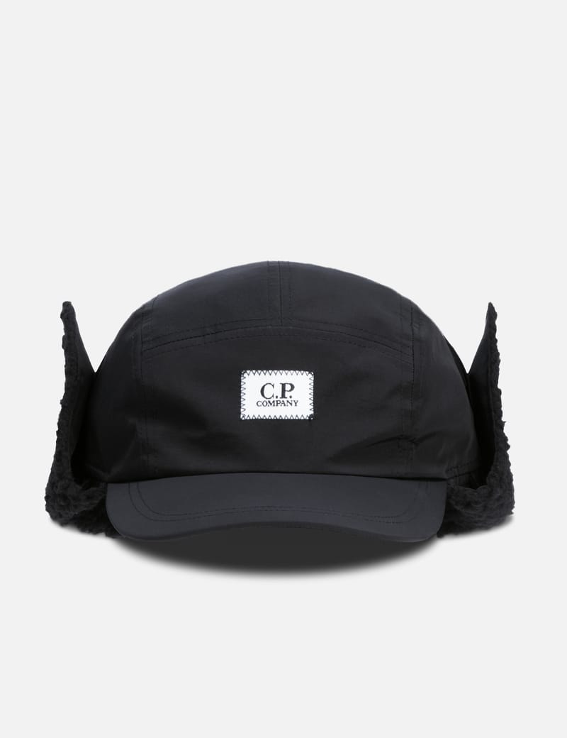 C.P. Company - CHROME-R EARFLAP HAT | HBX - Globally Curated