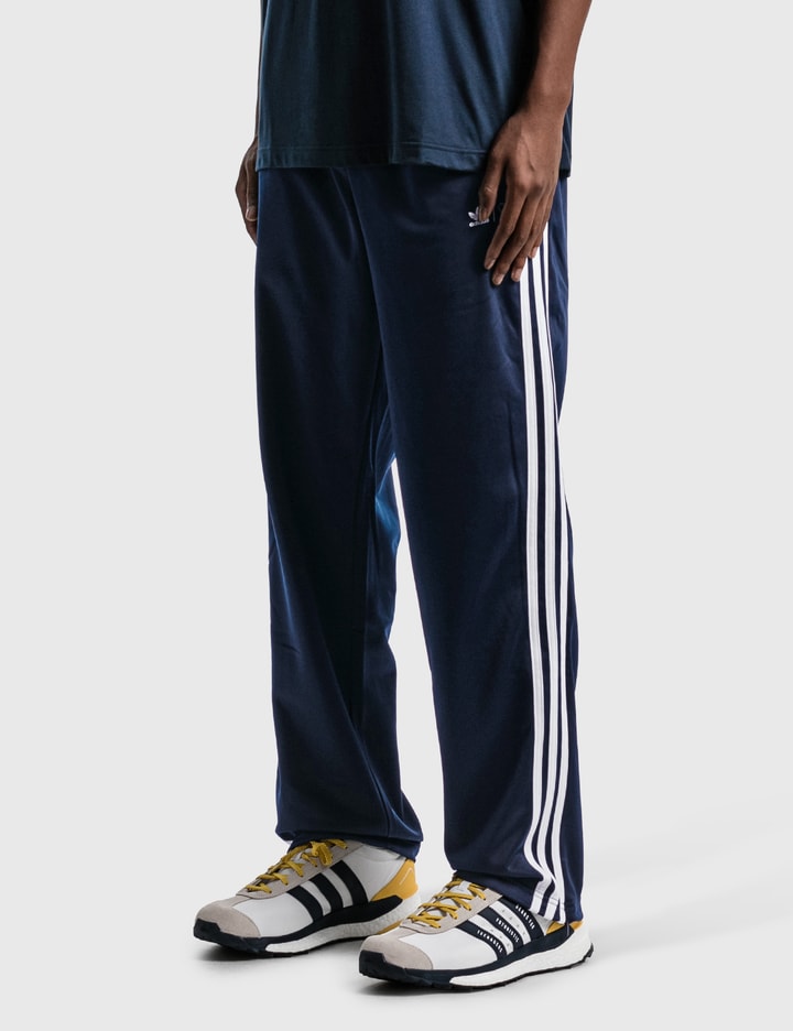 human being adidas pants