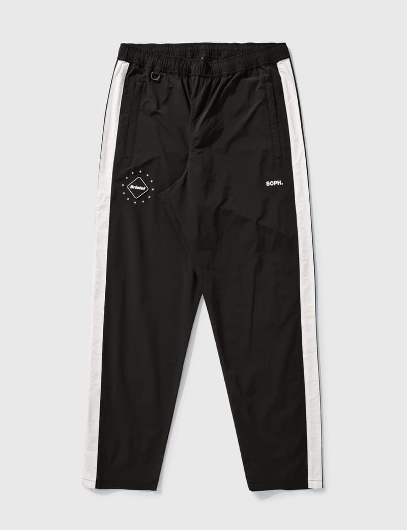 F.C. Real Bristol - SIDE LINE TRAINING PANTS | HBX - HYPEBEAST 為