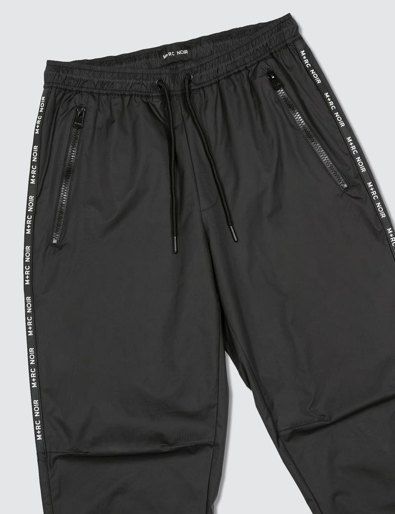 M+RC Noir - Millenium Track Pants | HBX - Globally Curated Fashion and  Lifestyle by Hypebeast