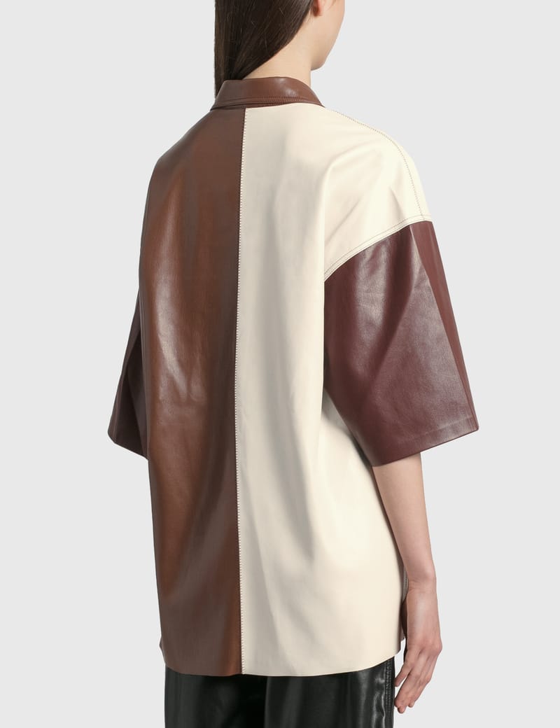 【Nanushka】 Roque fauxレザーシャツ Roque faux leather shirt in orange - Nanushka | Mytheresa