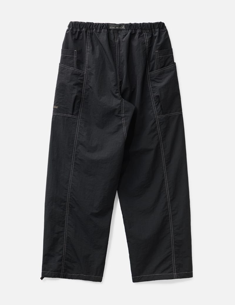 and wander - crinkled nylon pants | HBX - ハイプビースト