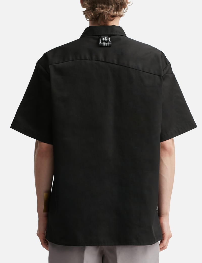 Undercover X Dickies Shirt - A unique curved button design