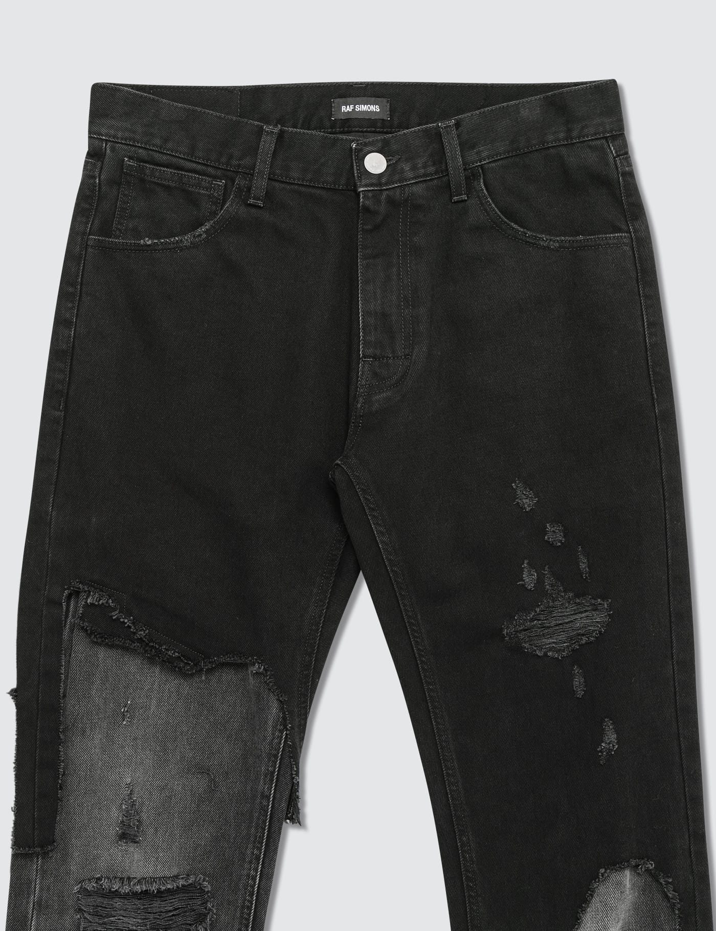 Raf Simons - Slim Fit Destroyed Jeans | HBX - Globally Curated 