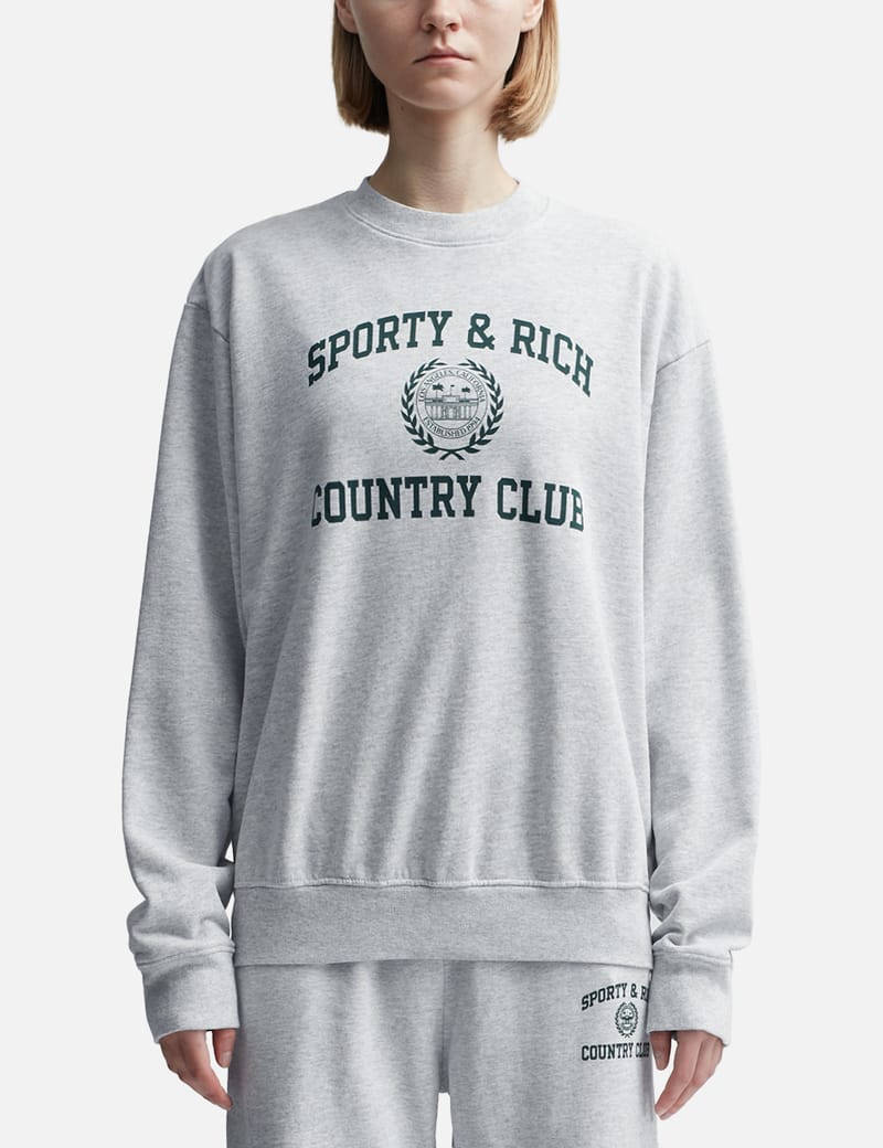 【Sporty & Rich】バーシティ クレスト クルーネックスウェット Sporty & Rich - バーシティ クレスト クルーネック | HBX