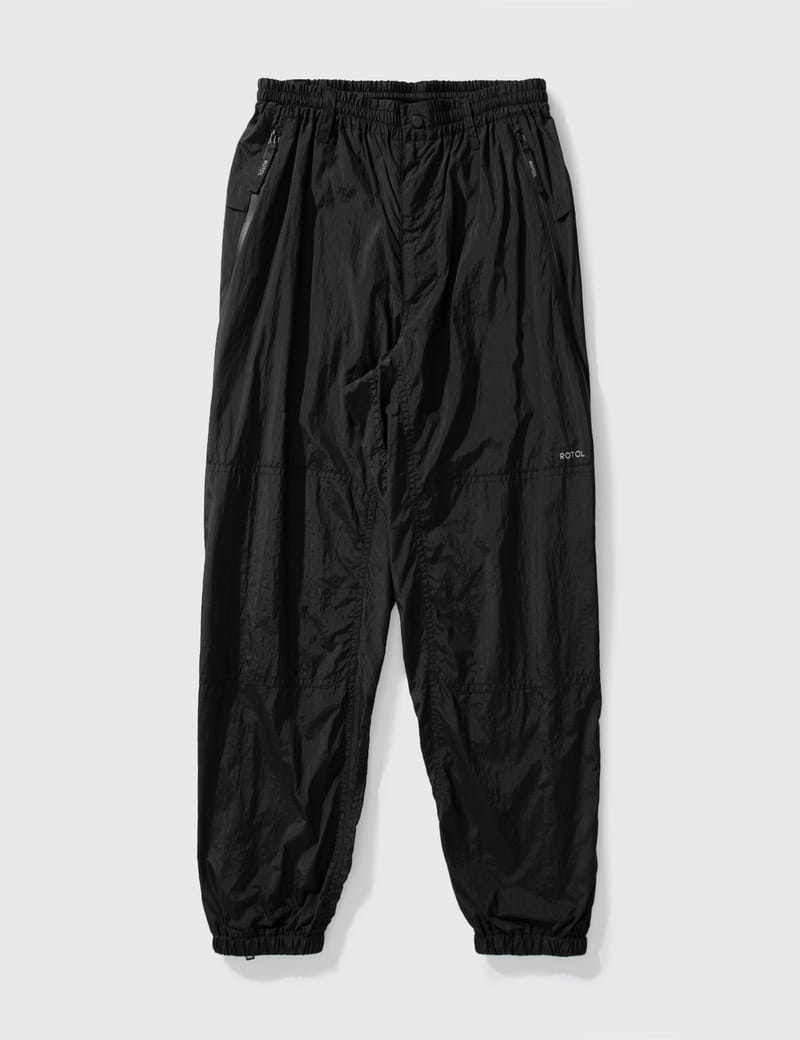 Rotol - TWIST TRACK PANTS | HBX - Globally Curated Fashion and