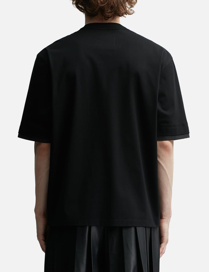 sacai-black-kaws-flock-print-