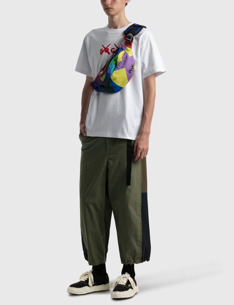 Sacai - KAWS Flock Print T-shirt | HBX - Globally Curated Fashion