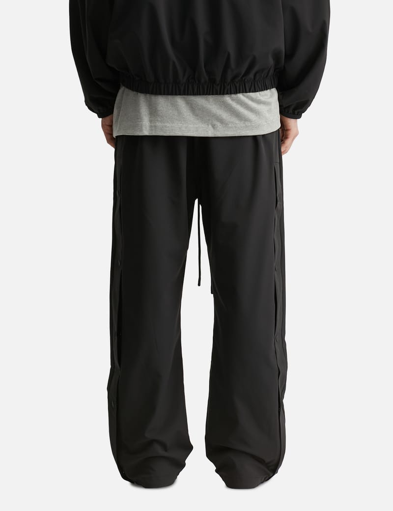 Fear of God Essentials NBA Nylon Tearaway Pant - Black wide-leg