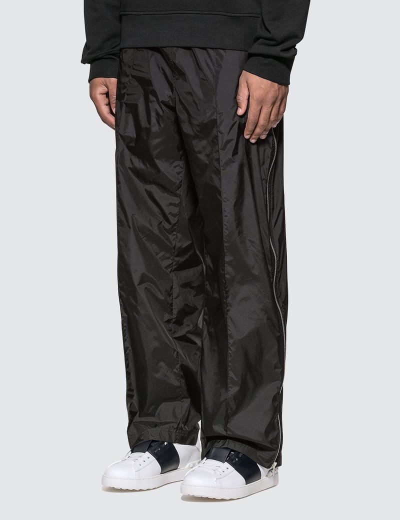 Maison Margiela - Packable Nylon Pants | HBX - Globally Curated