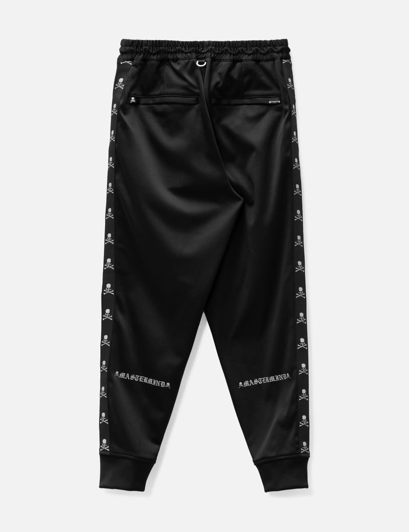 Mastermind Japan - Regular Skull Tape Track Pants | HBX